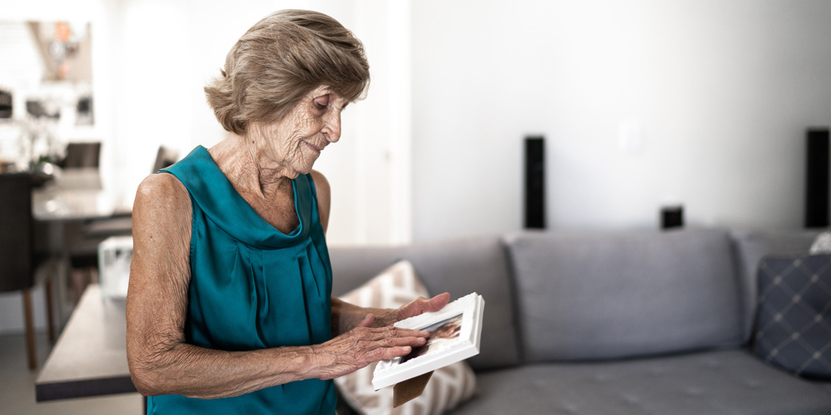 woman holding picture frame